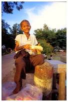 Young boy playing with money in Yangon, Myanmar